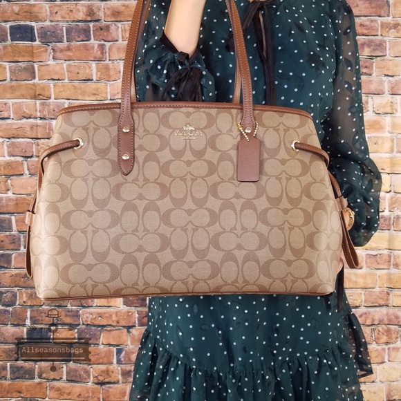 Coach Handbags - Coach signature pvc drawstring khaki brown tote
